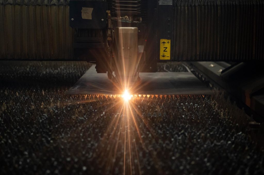 Sparks in side sheet metal laser cutting fabrication